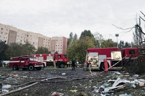 Rescuers work at the scene of a building damaged by shelling in Zaporizhzhia, Ukraine, Sunday.

