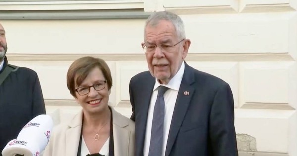 Austria's President Alexander Van der Bellen and his wife Doris speak to the media in front of a polling station in Vienna, in presidential elections on Sunday.