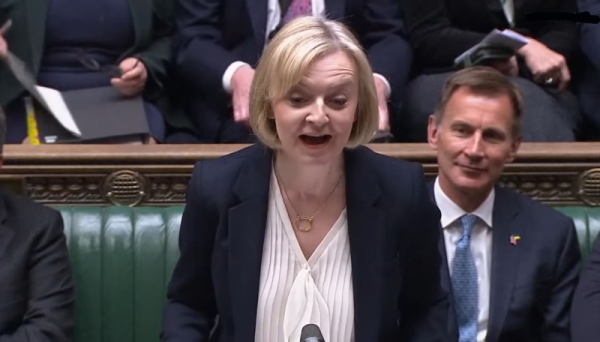 Liz Truss speaking in front of Britain’s Chancellor of the Exchequer Jeremy Hunt (back) during Prime Minister’s Questions in the House of Commons, London, Wednesday.
