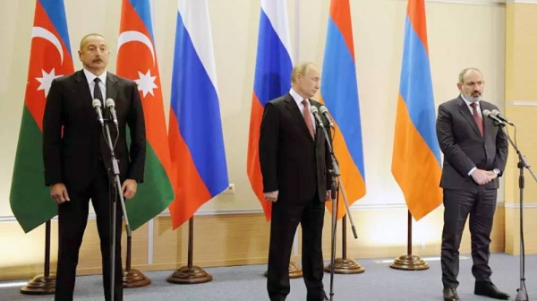 Azerbaijan's President Ilham Aliyev (left), Russian President Vladimir Putin (center) and Armenia's Prime Minister Nikol Pashinyan (right) during a summit in Sochi in November 2021. — courtesy Sputnik, Kremlin Pool Photo