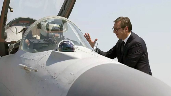 File photo shows Serbian President Aleksandar Vucic speaking with a pilot of MiG-29 jet fighter on the tarmac at Batajnica near Belgrade, August 2018. — courtesy photo