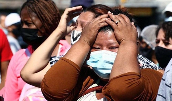 Relatives waited for news after police stormed the jail in Guayaquil where a deadly riot took place. — courtesy photo