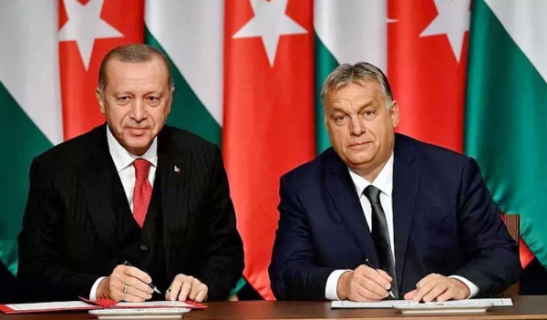 File photo shows Turkish President Recep Tayyip Erdogan, left, and Hungarian Prime Minister Viktor Orban signing a document during their meeting in Budapest, Hungary, on Nov. 7, 2019.