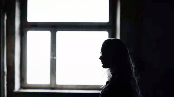 Illustrative photo of a girl in a dark room. — courtesy Pixabay