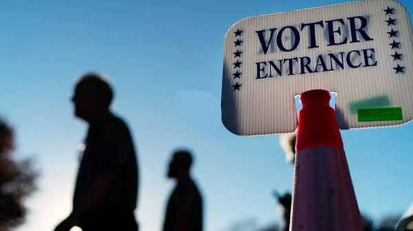 Voters pass a sign outside a polling site in Warwick, R.I., Monday, Nov. 7, 2022, after casting their ballots on the last day of early voting before the midterm election. — courtesy photo