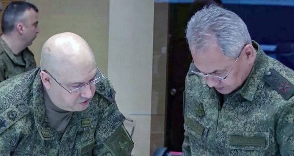 Gen. Sergei Surovikin (L) said the withdrawal, ordered by the Defense Minister Sergei Shoigu (R) was a difficult decision. — courtesy , Russian Defense Ministry