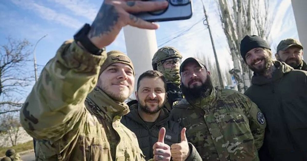 Ukrainian soldiers take a selfie with President Volodymyr Zelenskyy during his visit to Kherson. — courtesy Ukrainian Presidential Press Office