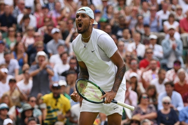 Nick Kyrgios of Australia celebrates a point against Brandon Nakashima of United States during their Men's Singles fourth round match of the Wimbledon 2022 event at All England Lawn Tennis and Croquet Club on July 04, 2022 in London, England. (Photo by Shaun Botterill/Getty Images)