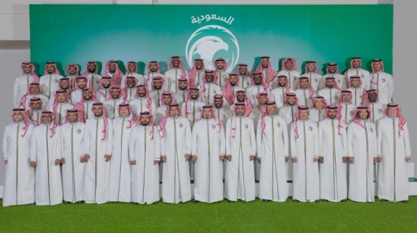 The Saudi squad for the FIFA World Cup 2022, accompanied by Coach Hervé Renard and other officials, pose for a photo, wearing the traditional Saudi garb, before traveling to Qatar on Wednesday.