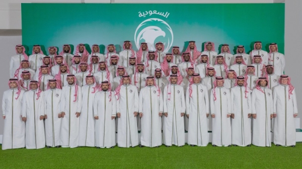 The Saudi squad for the FIFA World Cup 2022, accompanied by Coach Hervé Renard and other officials, pose for a photo, wearing the traditional Saudi garb, before traveling to Qatar on Wednesday.