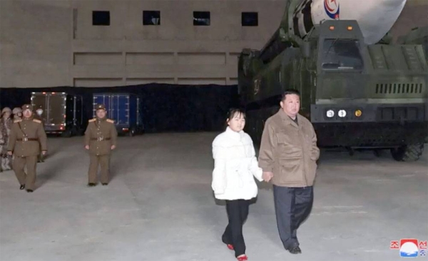 North Korean leader Kim Jong Un, right, and his daughter inspects a missile at Pyongyang International Airport in Pyongyang, North Korea, Friday.