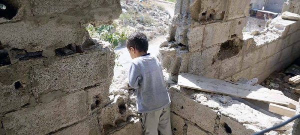 In a neighborhood in Aden, Yemen, a three-year-old girl (center) plays with neighborhood friends after losing her twin sister to measles. – courtesy UNICEF/Saleh Hayyan