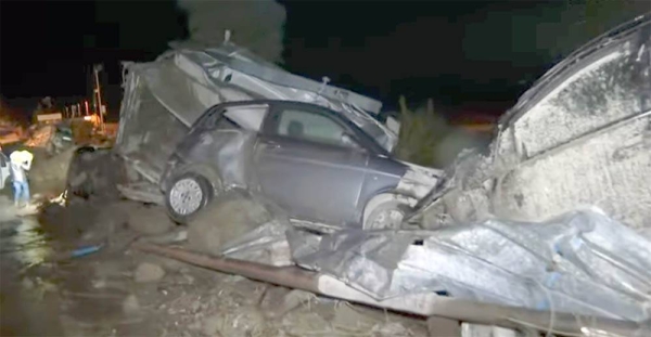 Damaged vehicles are seen after heavy rain triggered landslides that collapsed buildings and left up to 12 people missing, in Casamicciola, Ischia, on Saturday.