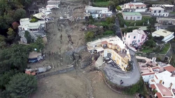 The remains of cars and buses crushed by the violent mudslide and rockslide can be seen everywhere as excavators try to clear access to homes, cars and shops.