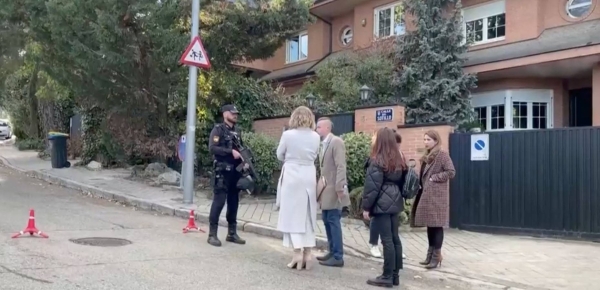 Police officers stand guard at the cordoned off area next to the Ukrainian embassy in Madrid, Spain.