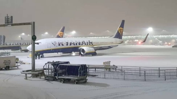 Planes at Stansted were seen blanketed in snow on Sunday night
