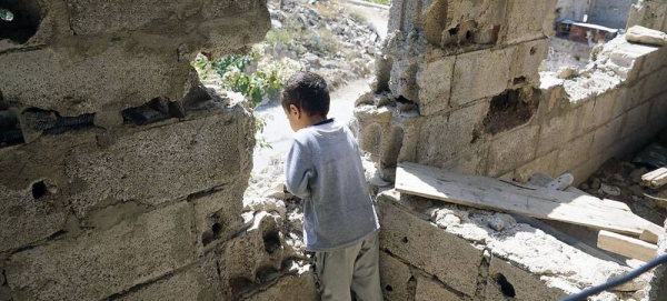 A boy looks out from his home in the volatile area of Al Gamalia in Taiz, Yemen. (file) — courtesy UNOCHA/Giles Clarke