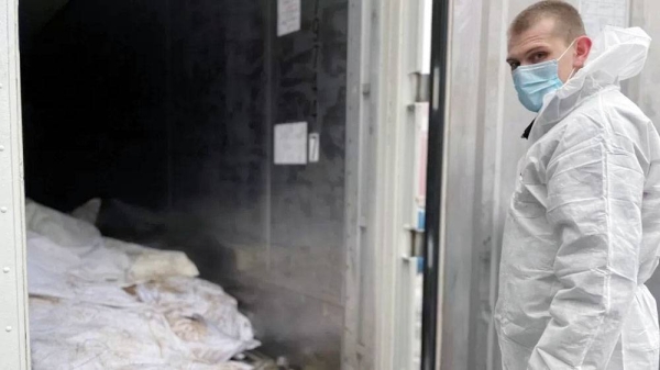 The unidentified remains of some of those killed in Izyum are being kept in a container in Kharkiv. — courtesy photo
