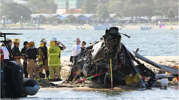 Emergency personnel at the scene of the collision