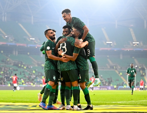 The Saudi national team players celebrate after  a 2-0 victory over Yemen, in the first round of the group stage of the 25th Arabian Gulf Cup 2023 match at Basra International Stadium, in Basra.