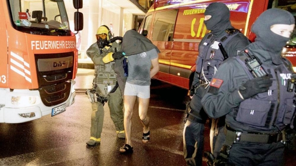 German police detain the suspect in Castrop-Rauxel, North Rhine-Westphalia state, on Sunday. — courtesy Karsten Wickern/picture alliance/dpa/AP