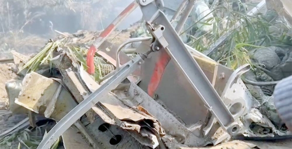 Rescuers and crowds gather at Nepal plane crash site. — courtesy screenshot