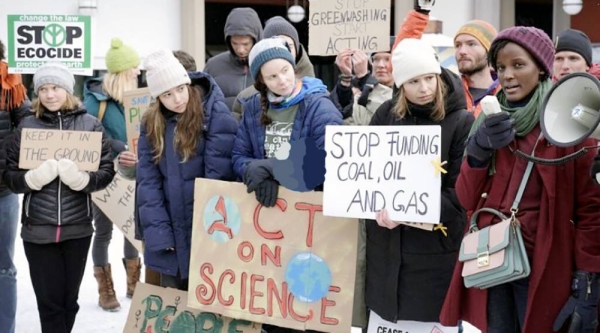 Activist Vanessa Nakate, right, speaks beside Luisa Neubauer, Greta Thunberg and Helena Gualinga among other activists at a climate protest outside the World Economic Forum. — courtesy AP 