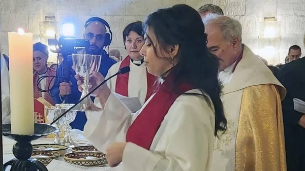 Sally Azar takes part in a service at the Lutheran church in Jerusalem. — courtesy Munther Isaac