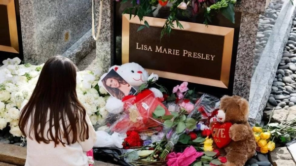 Fans visit the grave of Lisa Marie Presley during her memorial