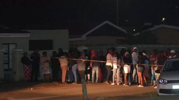 Bystanders gathered out the scene of the shooting