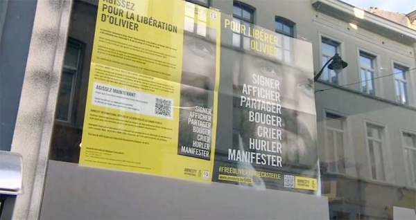 A banner asking to free Belgian aid worker Olivier Vandecasteele, currently detained in Iran, in Brussels, Belgium.

