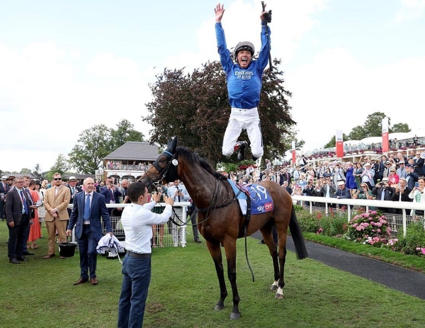 Frankie Dettori gives his trademark flying dismount after Trawlerman wins the Ebor Handicap at York last August.