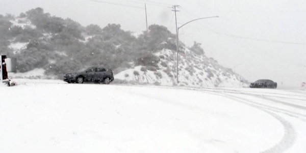 Rare snow carpets swaths of storm-hit California