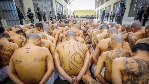 Gang members wait to be taken to their cells after 2,000 gang members were transferred to the Terrorism Confinement Center. — courtesy Reuters