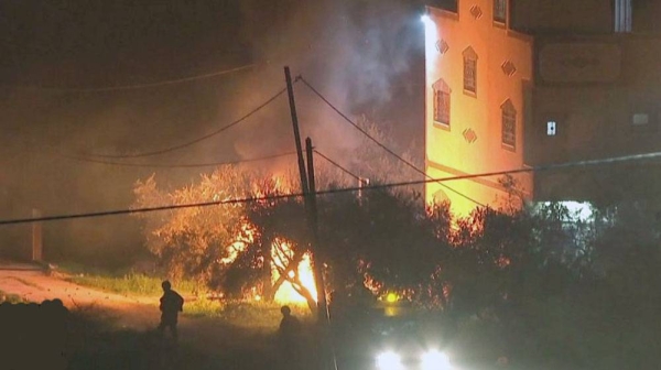 West Bank town set alight after Israelis killed.