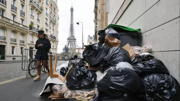 
Garbage cans overflowing with trash on the streets as collectors go on strike in Paris, France. Garbage collectors have joined the massive strikes throughout France against pension reform plans. — courtesy Getty Images