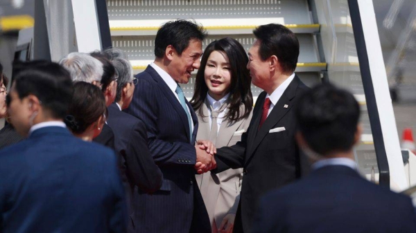 South Korean President Yoon Suk Yeol arrives at Haneda International Airport with his wife Kim Keon-hee in Tokyo on March 16, 2023.