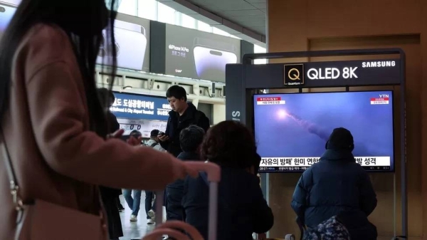 People in Seoul watching news reports of the long-range missile's launch on Thursday morning