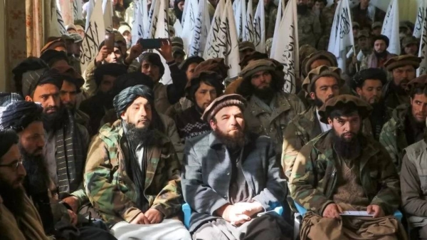 Taliban watch newly recruited personnel during a Februrary graduation ceremony