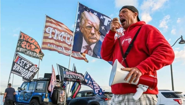 A small group of Trump supporters rally near the former president’s Mar-a-Lago Club in Florida on Tuesday. — courtesy Getty Images