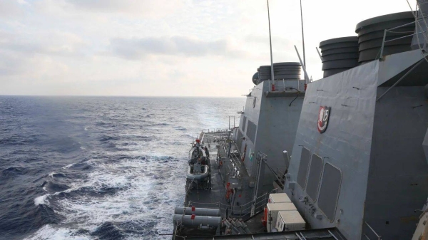 The guided-missile destroyer USS Milius conducts a freedom of navigation operation in the South China Sea on Friday