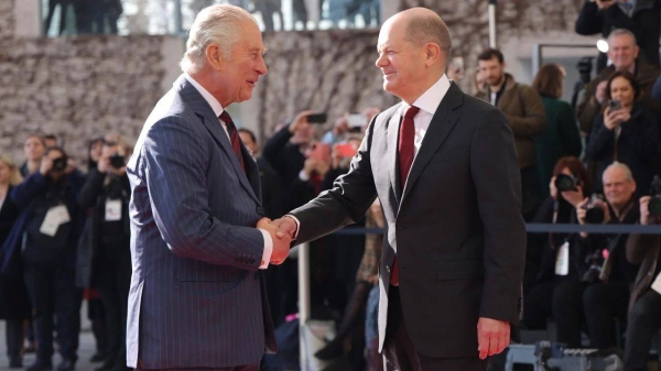 King Charles III is welcomed by German Chancellor Olaf Scholz at the Chancellery on Thursday in Berlin, Germany
