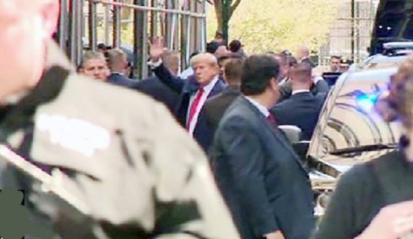 Donald Trump arrives at Manhattan courthouse ahead of arraignment on Tuesday.