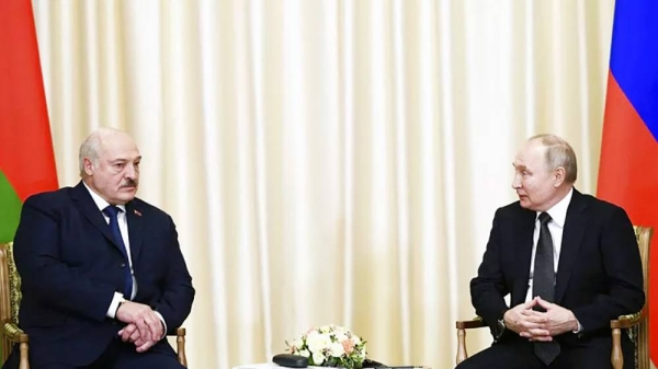 Russian President Vladimir Putin, right, and Belarusian President Alexander Lukashenko talk at a meeting in Russia in February, 2023. — courtesy Vladimir Astapkovich/ Sputnik
