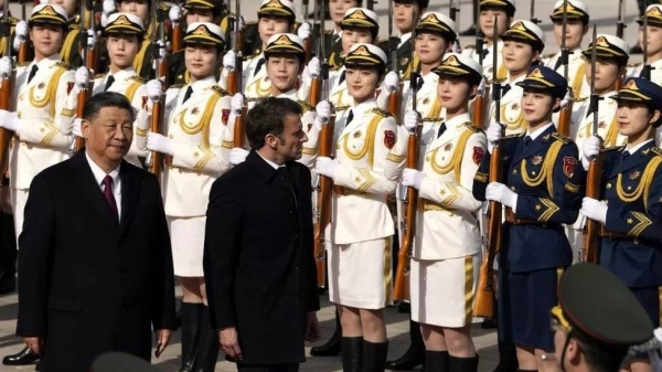 Macron was greeted with an elaborate military parade outside the Great Hall of the People