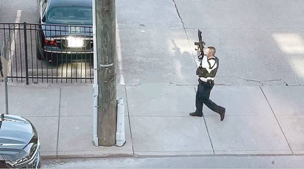 This photo provided by Reid Cornell shows police presence near the scene of a shooting in Louisville, Ky., Monday.