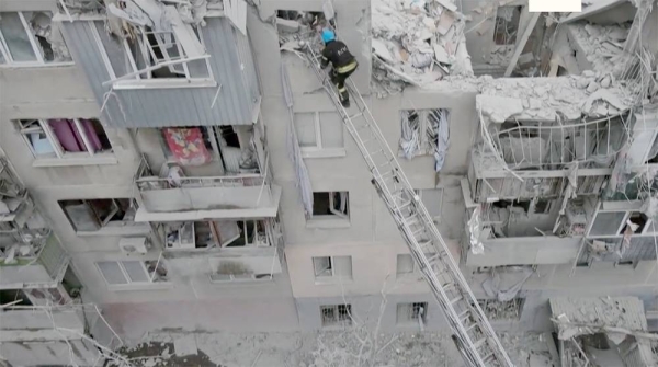 Firefighters on a rescue mission as they look for potential victims after Russian rocket attack in Sloviansk, Donetsk region, Ukraine, Friday.
