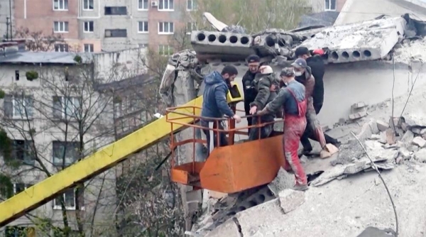 Firefighters on a rescue mission as they look for potential victims after Russian rocket attack in Sloviansk, Donetsk region, Ukraine, Friday.