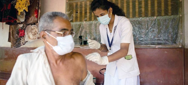 ANM, Health worker Deepa vaccinating people in far-flung villages. — courtesy UNDP India