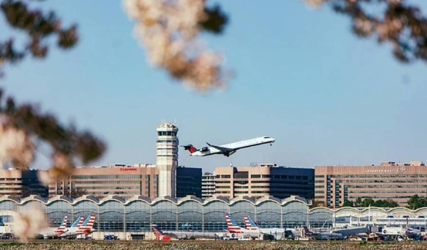 US ending COVID-19 mandates for air travelers. A plane takes off at Reagan International Airport in Washington.